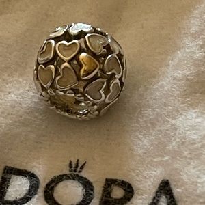 Super cute Pandora charm with pearl hears and a few gold heats mixed in.